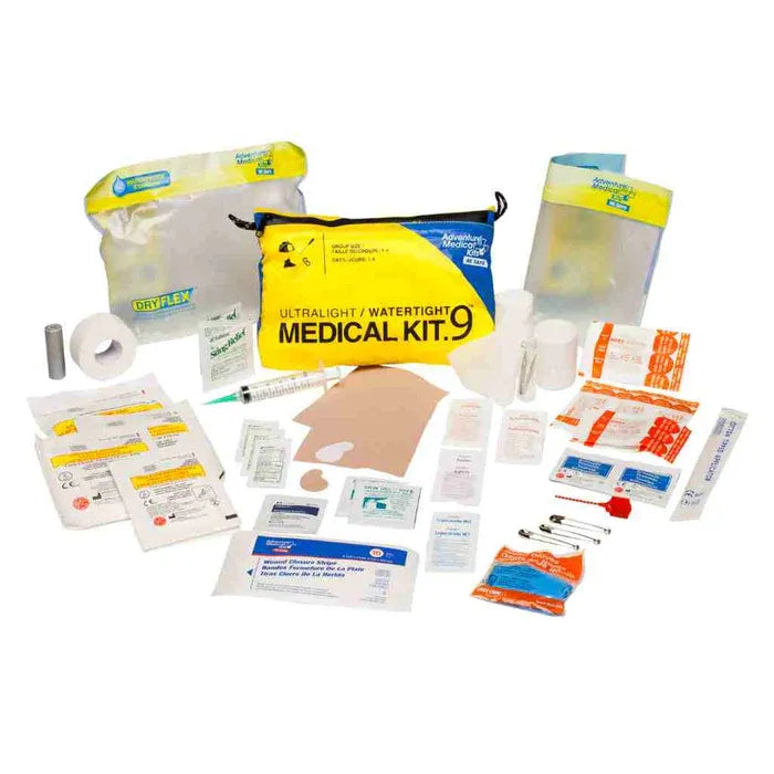 The Adventure Medical Kits Ultralight/Watertight .9 first aid kit showing the waterproof inner bag and comprehensive trauma supplies.