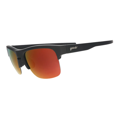 Angled view of the Goodr Unisex Flex G Sunglasses featuring a black half-rim frame and vibrant orange mirrored polarized lenses.