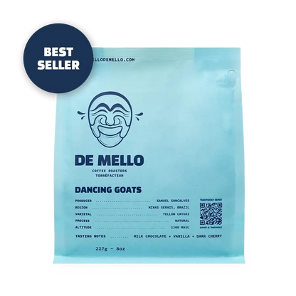 De Mello Daning Goats coffee package with branding and product details on a light blue background