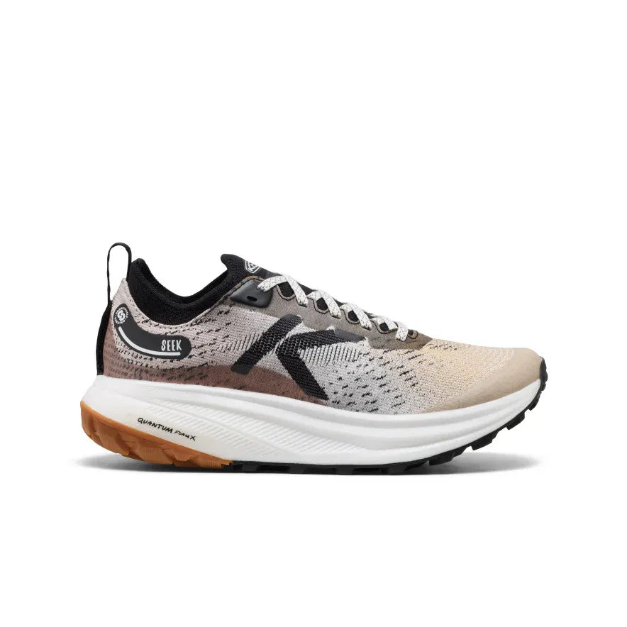 he Women's KEEN Seek Trail Running Shoe, showcasing its rugged all-terrain rubber outsole and generous forefoot design for off-road running.