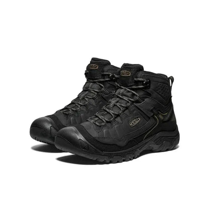 Pair of black KEEN Targhee IV hiking boots on a white background
