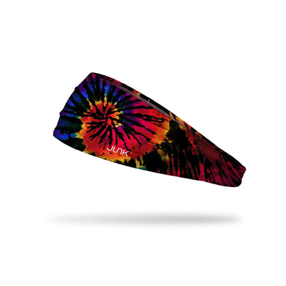 Tie-dye JUNK headband with colorful spiral pattern on a white background