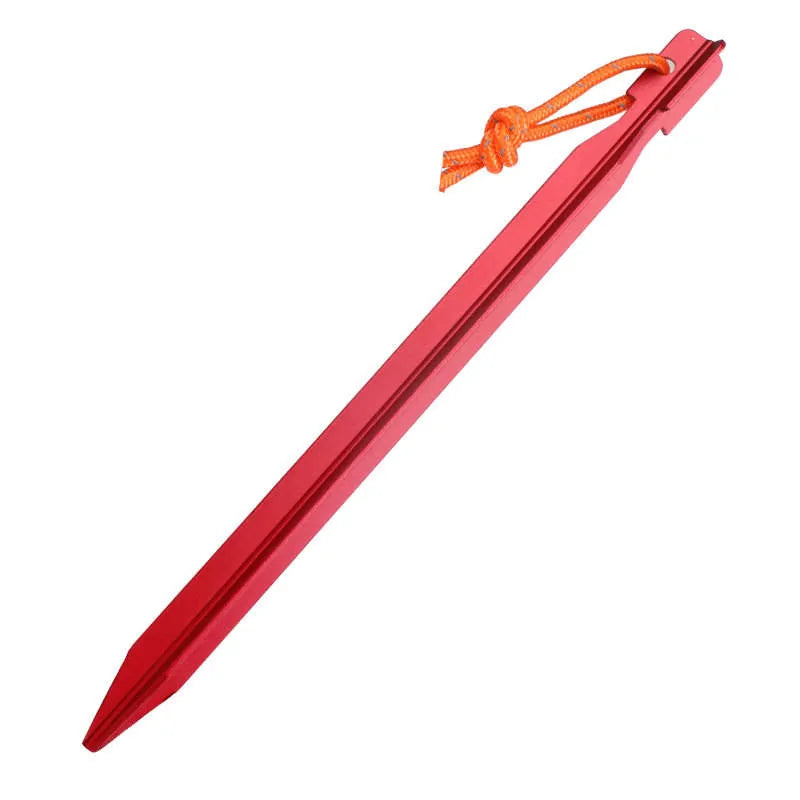 Red tent peg with an orange string on a white background