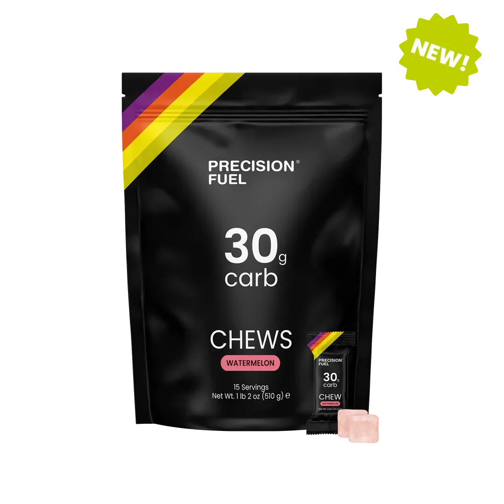 Precision Fuel 15 pack of 30g carb chews packaging with a small chew visible on a white background