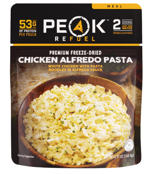 Package of Peak Refuel Premium Freeze-Dried Chicken Alfredo Pasta with visible text and branding.