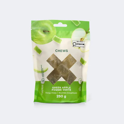 A 250g pouch of Xact Green Apple Energy Minis shown with bite-sized, soft fruit jelly chews ready for endurance fueling.
