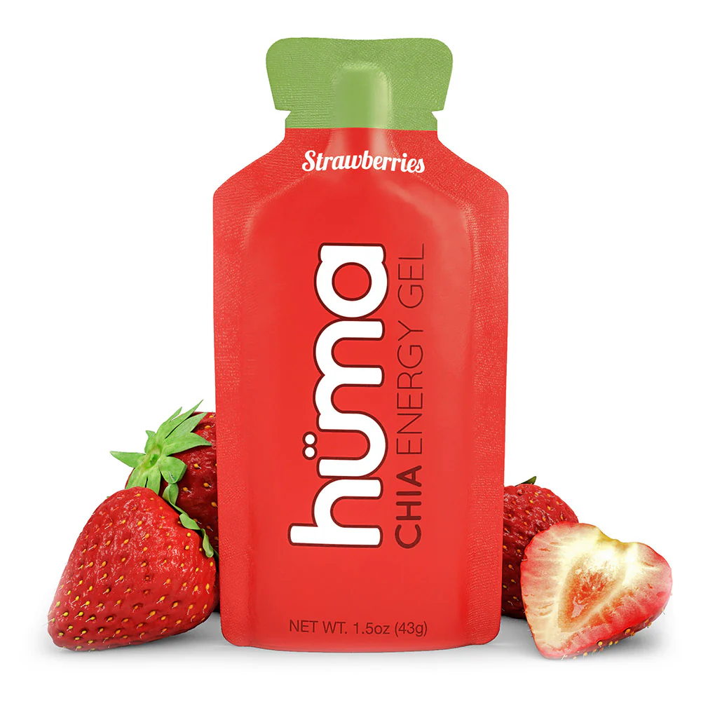 The Hüma Strawberries Energy Gel packet, with real strawberries on a white background