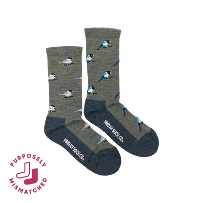 Two mismatched merino wool green socks with bird patterns on a white background, featuring the brand 'Friday Sock Co'.