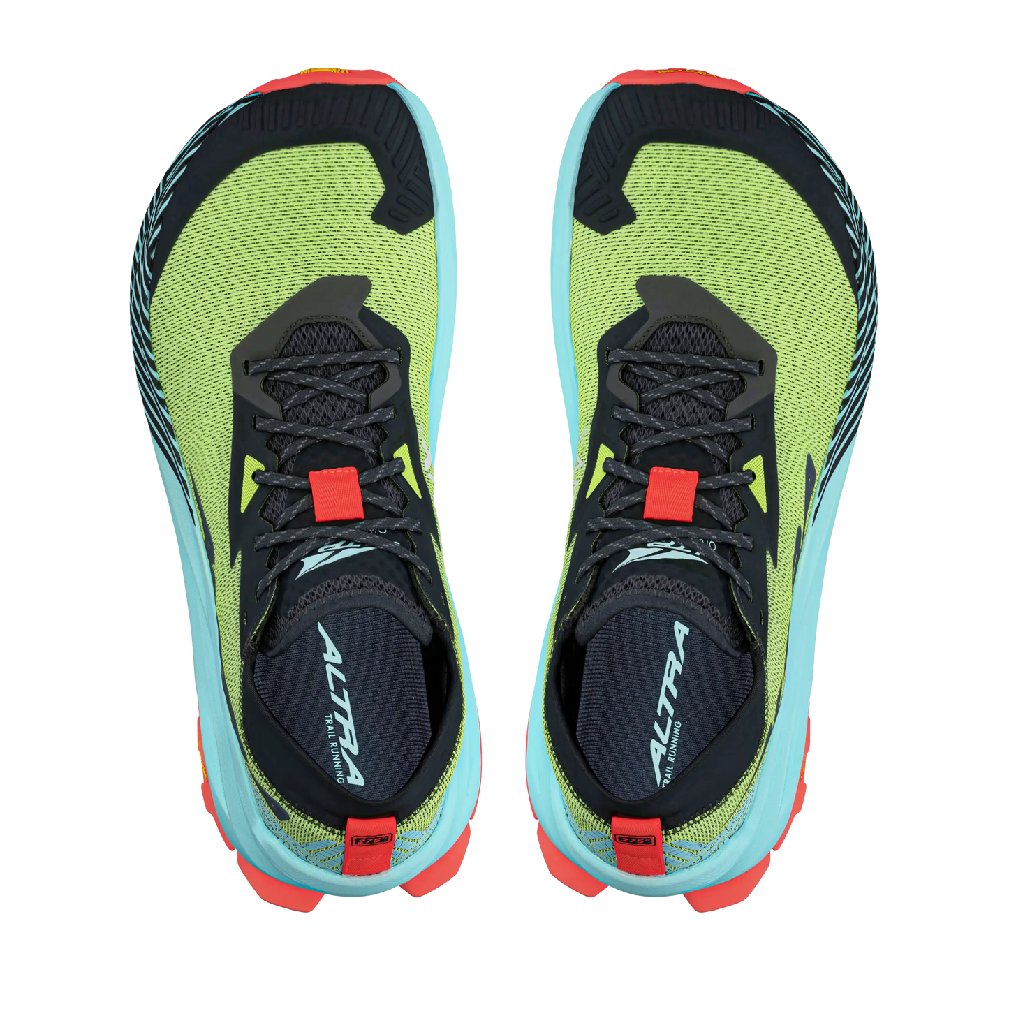 Pair of green and black running shoes with red and blue accents on a white background